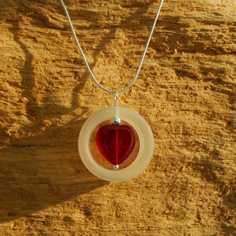 Glass ring with red heart pendant