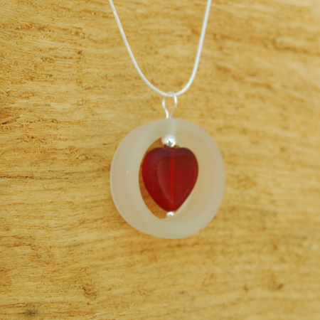 Glass ring with red heart pendant