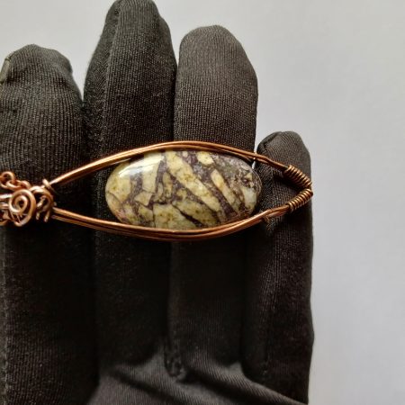 Wire wrapped Flourite in Feldspar cabochon pendant.