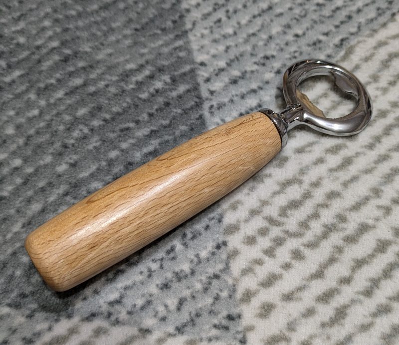Bottle opener made from Beech wood with a stainless steel opener