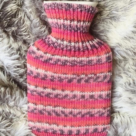 Pocket size dinky hot water bottle with hand crafted cover (yarn design Claire)