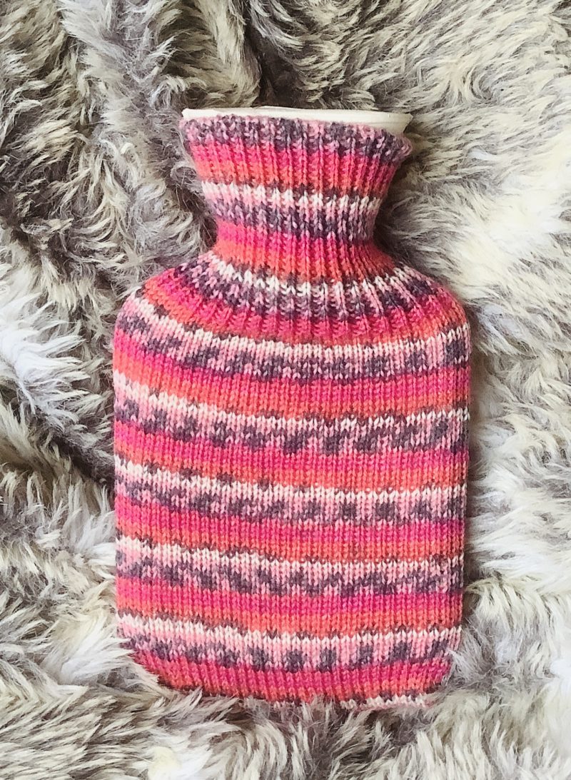 Pocket size dinky hot water bottle with hand crafted cover (yarn design Claire)