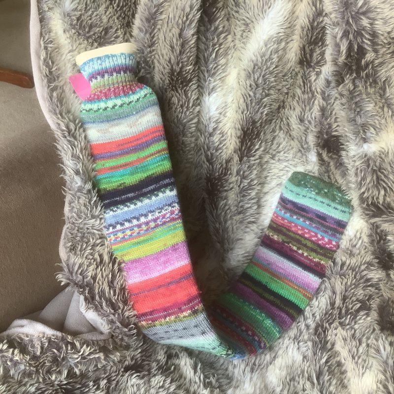 Extra long hot water bottle with hand crafted cover ( yarn design Random)