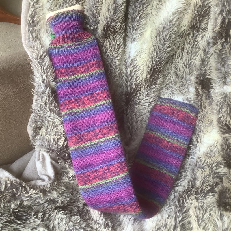 Extra long hot water bottle with hand crafted cover (yarn design George)
