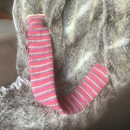 Extra long hot water bottle with hand crafted cover (yarn design Claire)