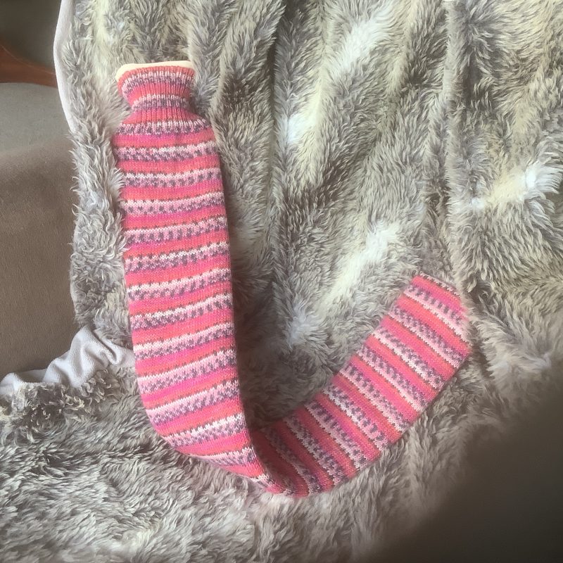 Extra long hot water bottle with hand crafted cover (yarn design Claire)