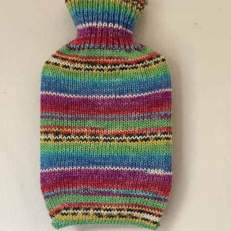 Pocket size dinky hot water bottle with hand crafted cover (yarn design Charlie)