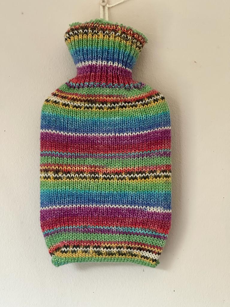 Pocket size dinky hot water bottle with hand crafted cover (yarn design Charlie)