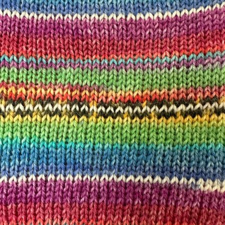 Pocket size dinky hot water bottle with hand crafted cover (yarn design Charlie)