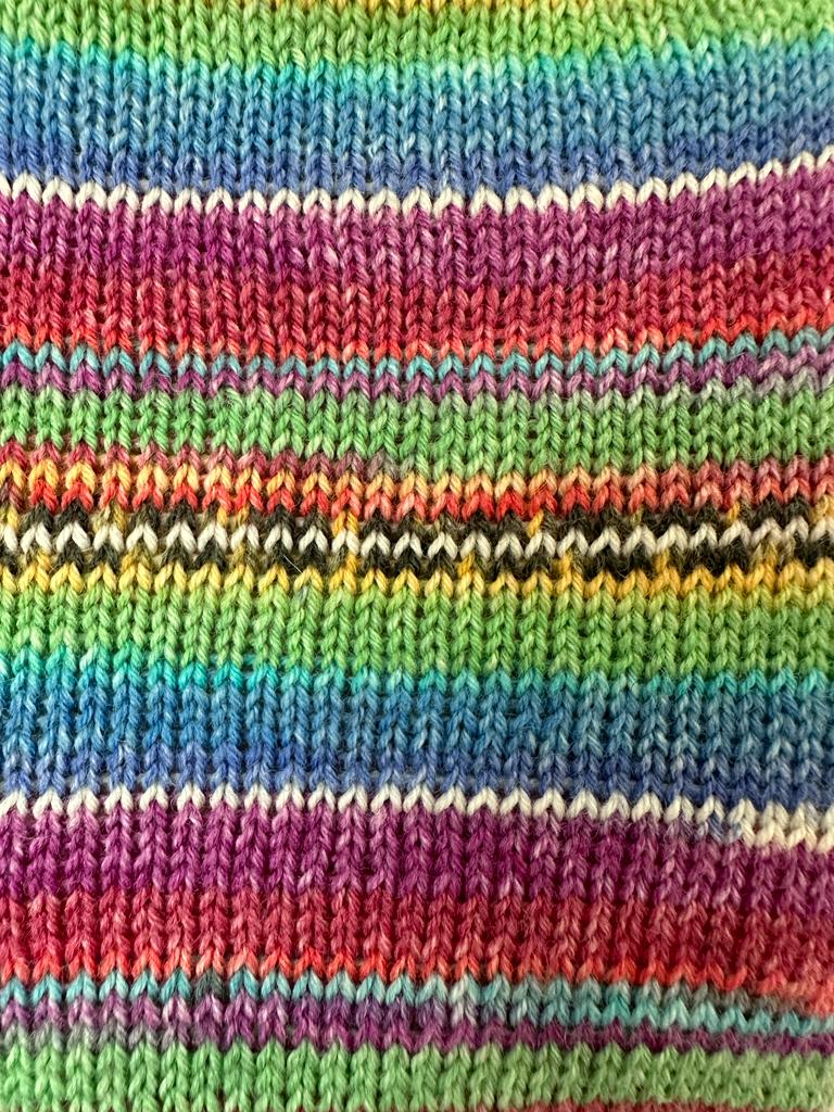 Pocket size dinky hot water bottle with hand crafted cover (yarn design Charlie)