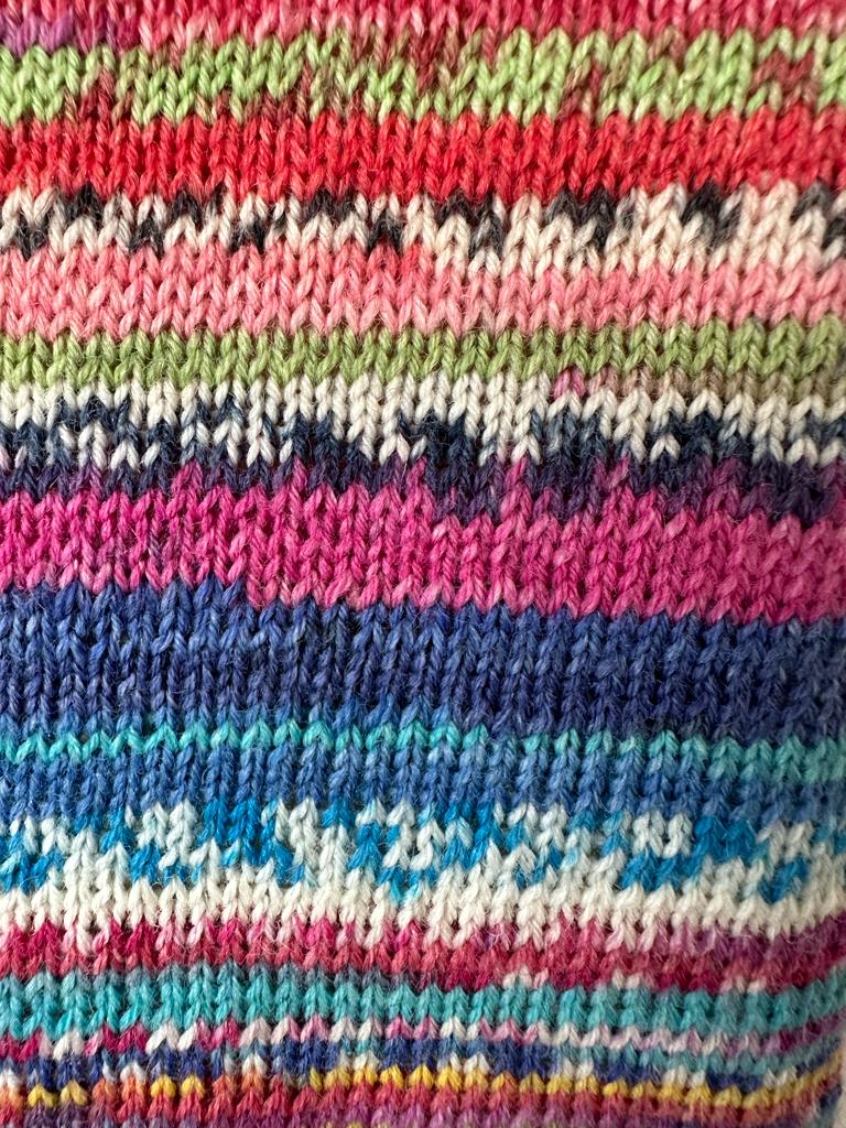 Extra long hot water bottle with hand crafted cover ( yarn design Random)