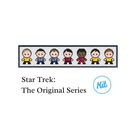 A black photo frame containing a cross stitch design of the crew from Star Trek The Original Series. Including Captain Kirk, Spock, Dr McCoy, Scotty, Uhura, Sulu and Chekov