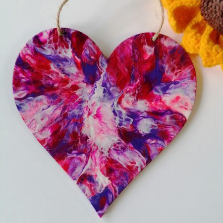 Wood heart wall decoration hand painted with hot pink, purple, red and white. Good size heart 15cm by 15cm. With jute cord ready to hang on the wall.