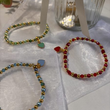 Stretch multi-bead bracelet with enamel heart charm