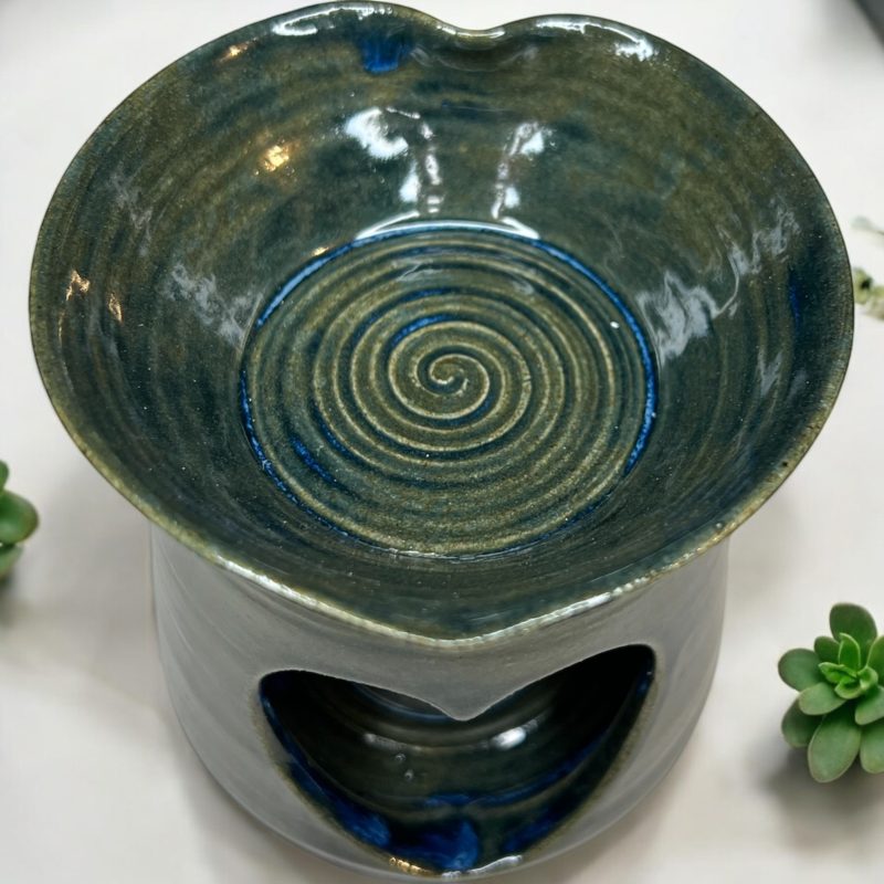 Handthrown beautiful heart shaped oil burner with detachable lid.