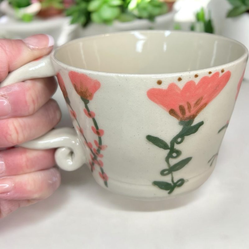Handthrown mug with hand drawn floral design