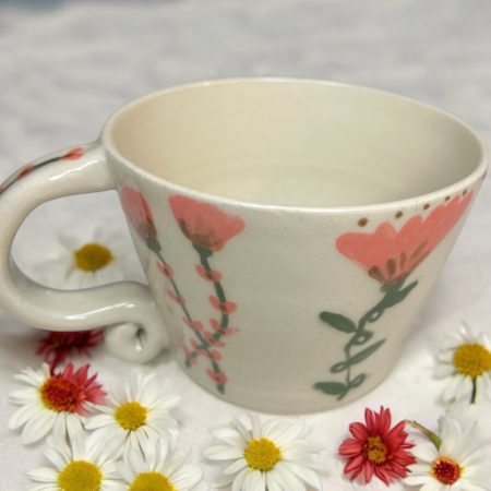 Handthrown mug with hand drawn floral design