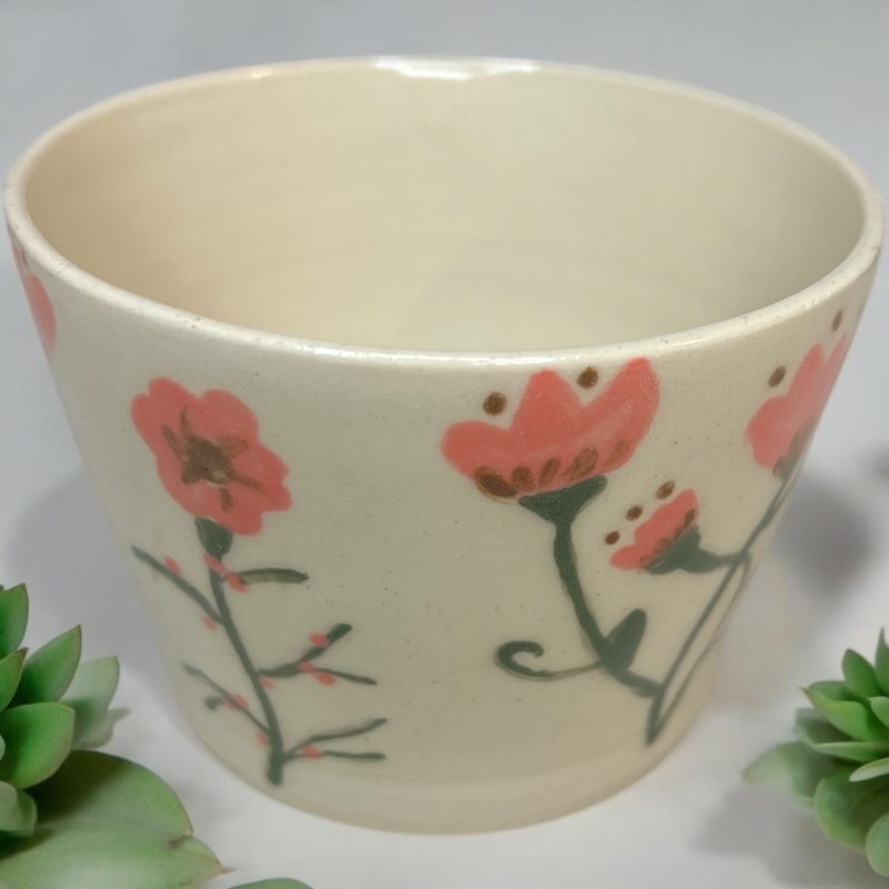Handthrown mug with hand drawn floral design