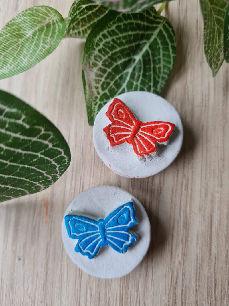 2 Clay butterfly magnets blue and red