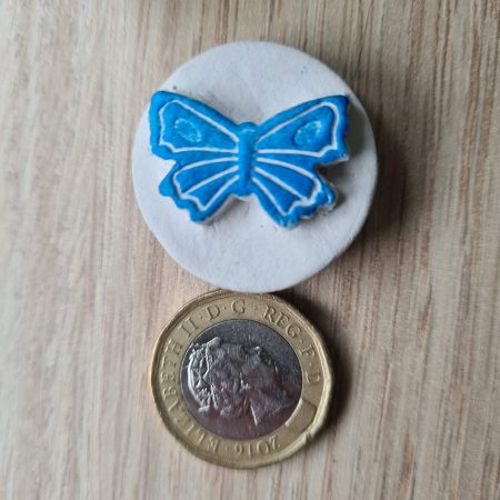 2 Clay butterfly magnets blue and red