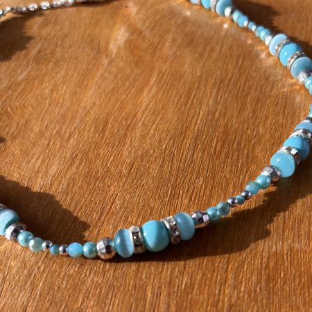 Turquoise and silver colour necklace.