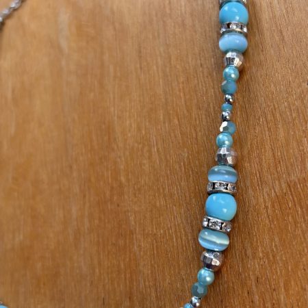 Turquoise and silver colour necklace.