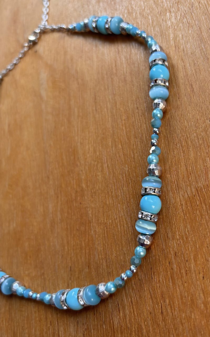 Turquoise and silver colour necklace.