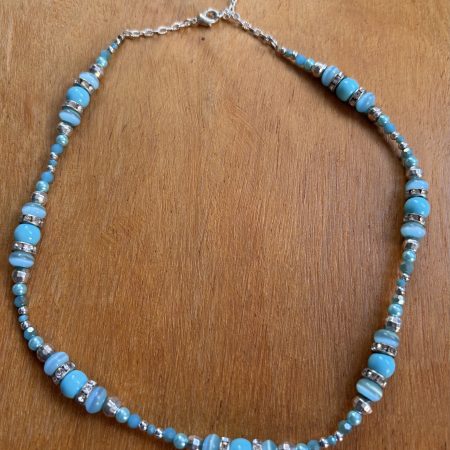 Turquoise and silver colour necklace.