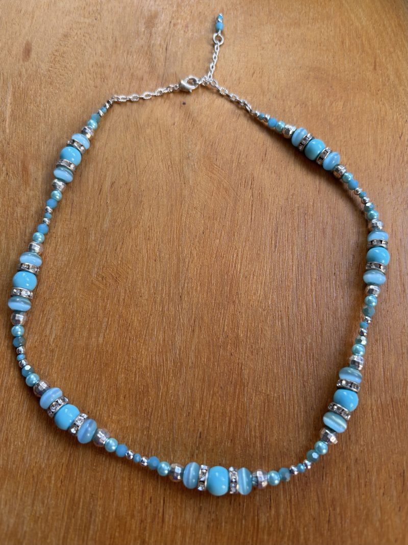 Turquoise and silver colour necklace.