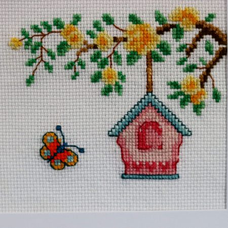 A Handmade Cross Stitch Greetings card framed in a White Aperture card left black inside for you to add your own personal message for any loved one