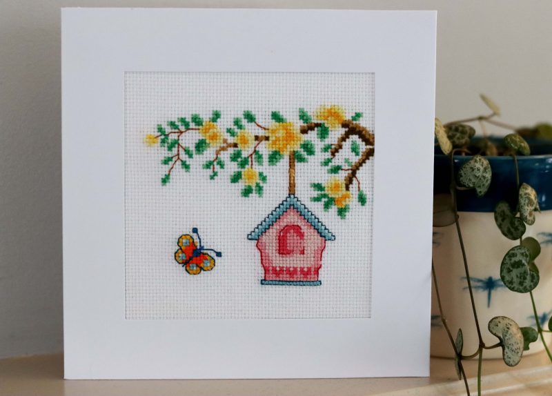 A Handmade Cross Stitch Greetings card framed in a White Aperture card left black inside for you to add your own personal message for any loved one