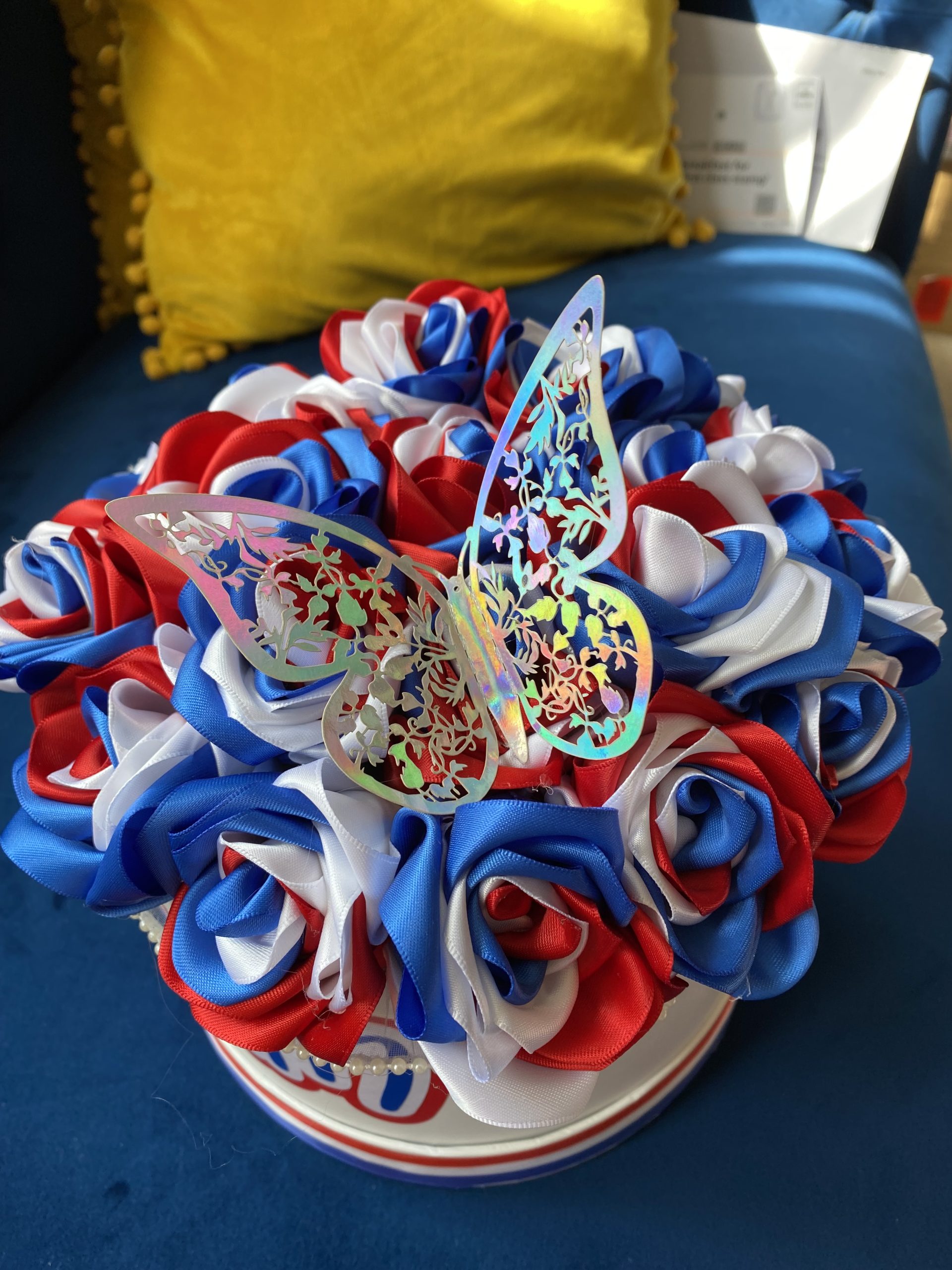Medium sized round box of hand made Ribbon Roses