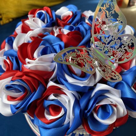 Medium sized round box of hand made Ribbon Roses