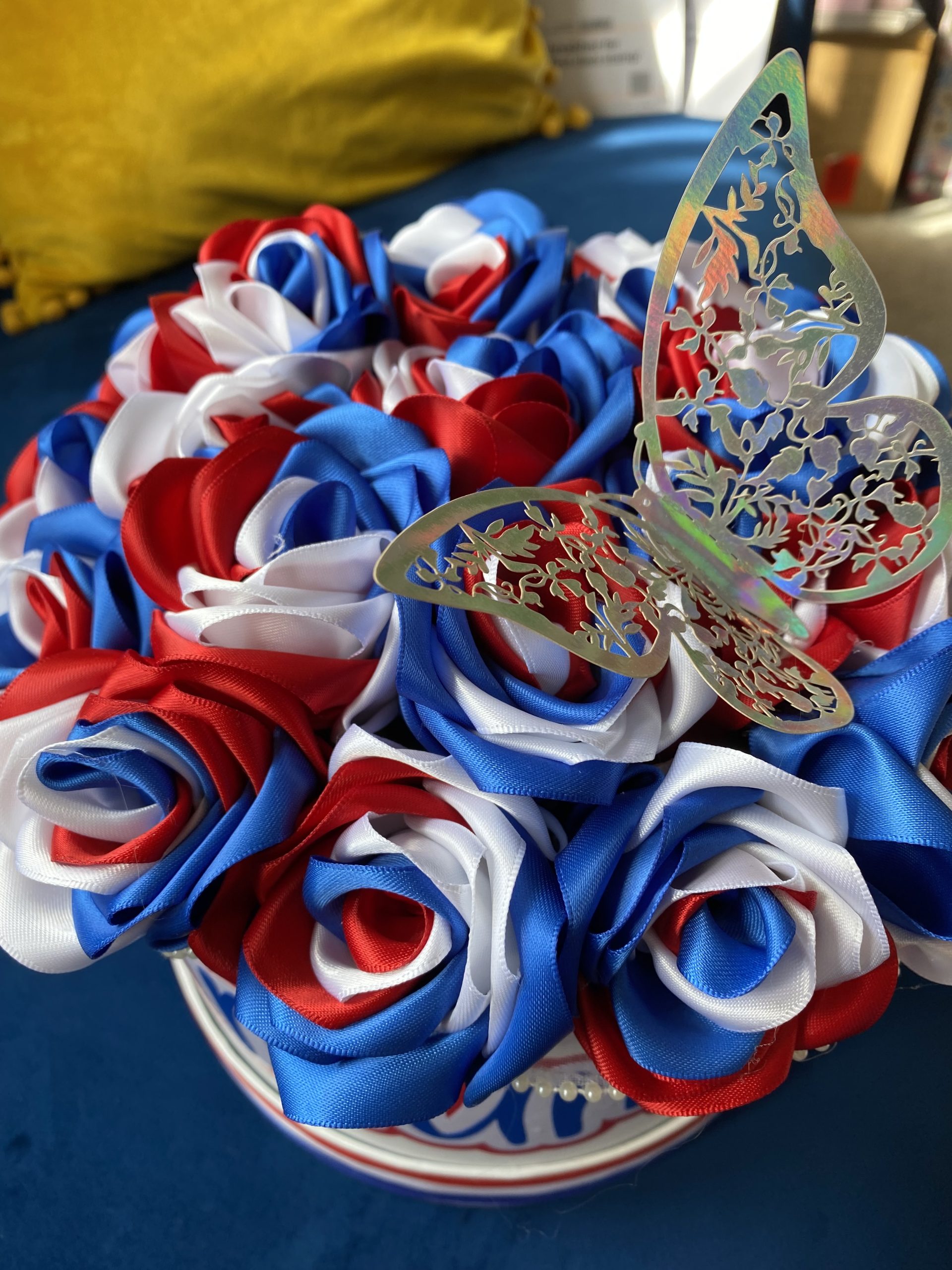 Medium sized round box of hand made Ribbon Roses