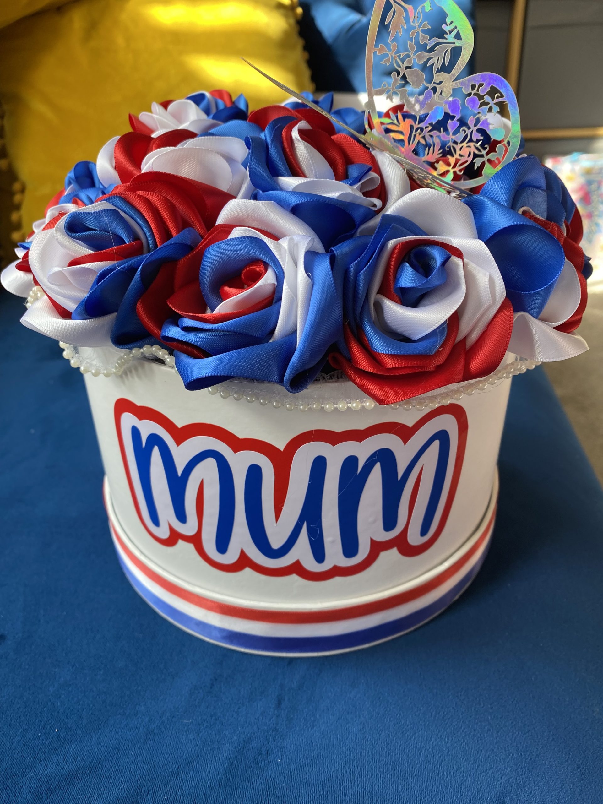 Medium sized round box of hand made Ribbon Roses