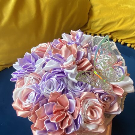Medium sized round box of hand made ribbon flowers