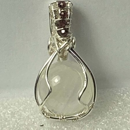 Wire-wrapped moonstone and garnet pendant