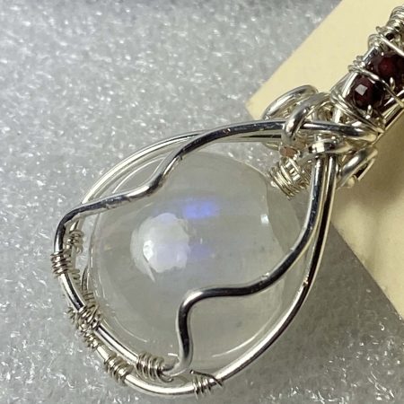 Wire-wrapped moonstone and garnet pendant