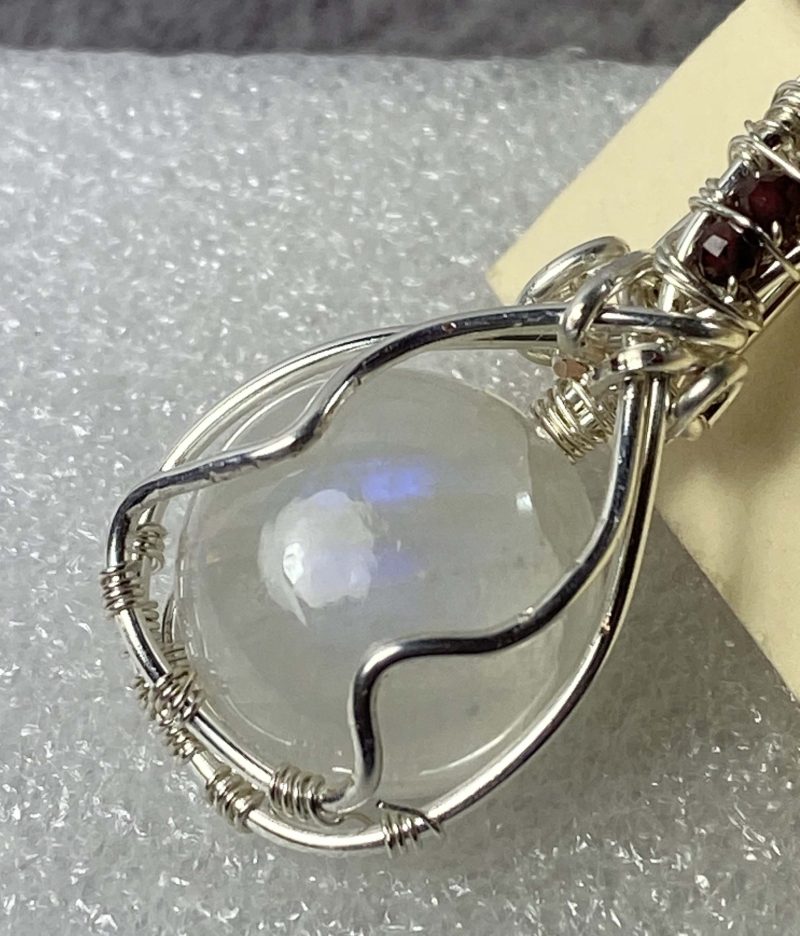 Wire-wrapped moonstone and garnet pendant