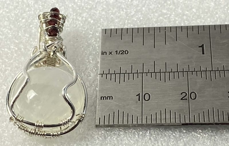 Wire-wrapped moonstone and garnet pendant