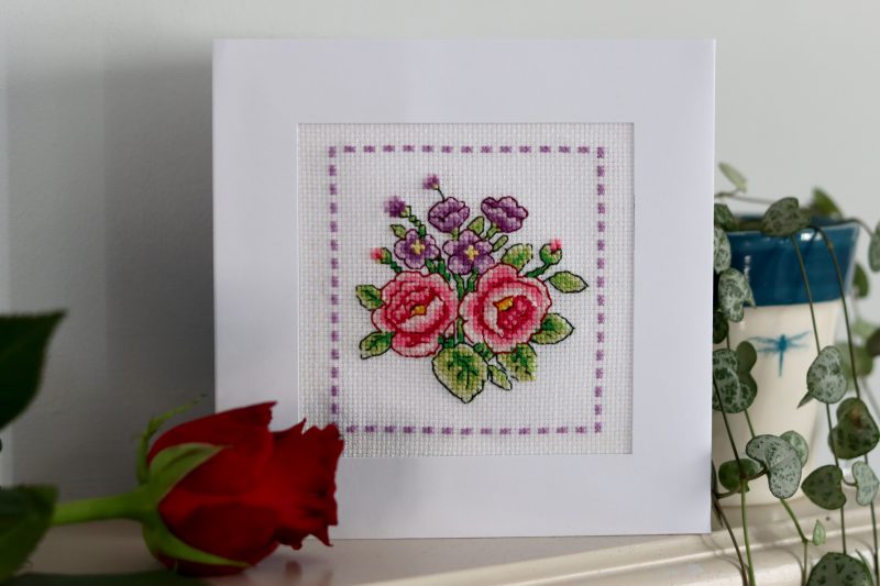 A Handmade Cross Stitch Greetings card framed in a White Aperture card left black inside for you to add your own personal message for any loved one