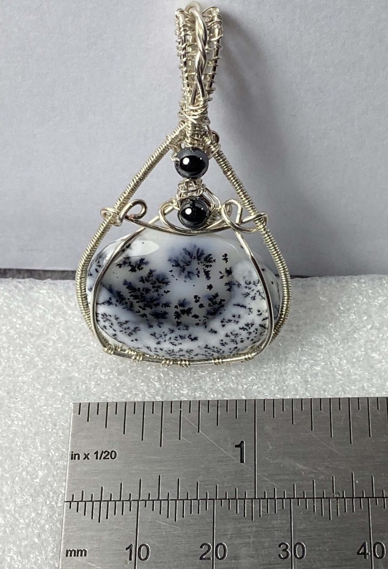 Absolutely stunning dendritic chalcedony wrapped in silver plated wire with haematite detail