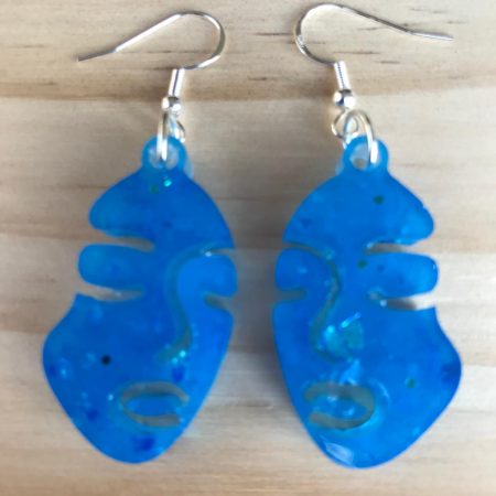 Glow in the dark face earrings