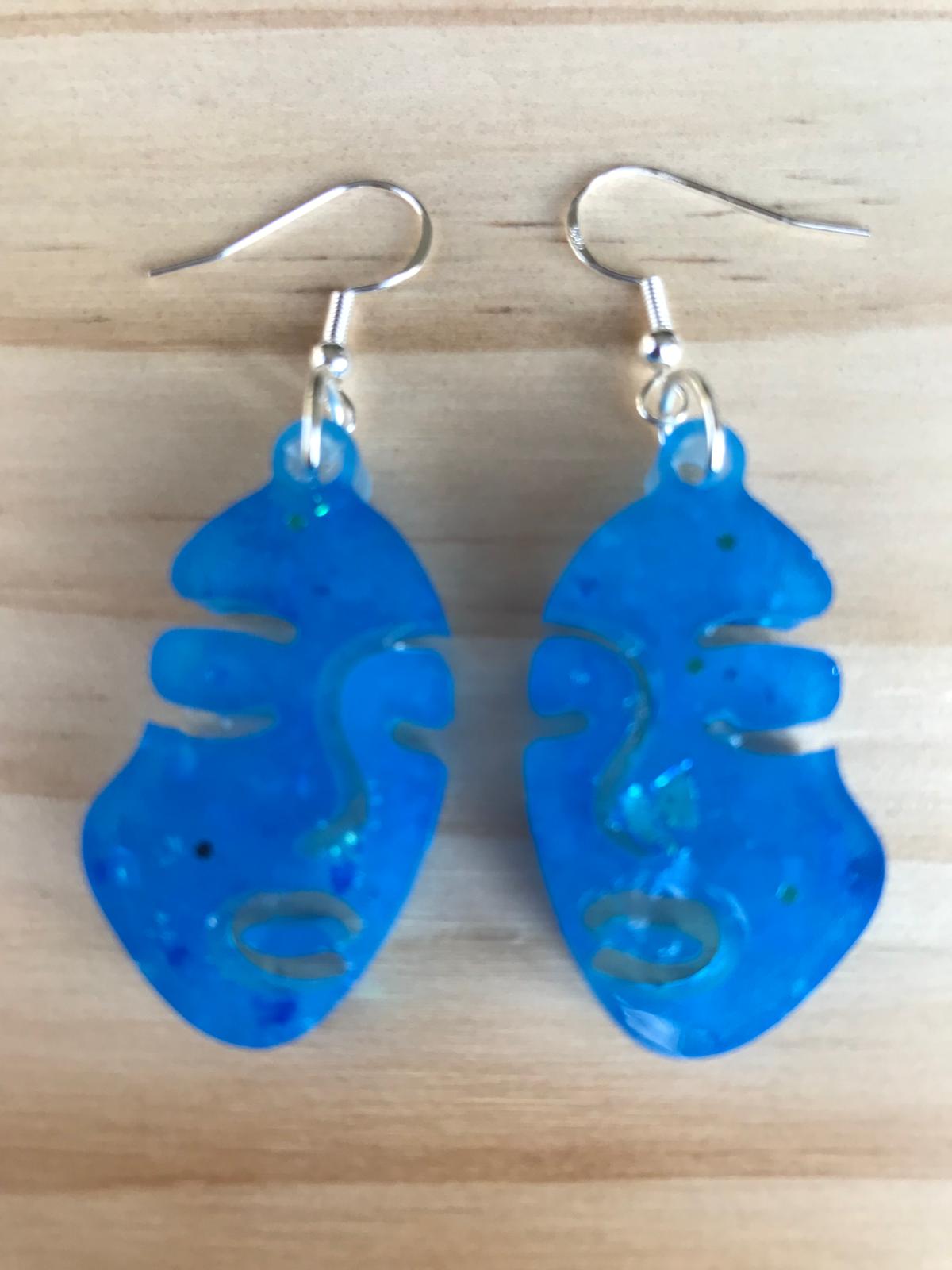 Glow in the dark face earrings