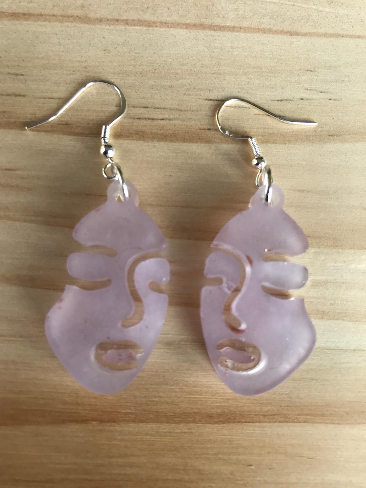 Glow in the dark face earrings