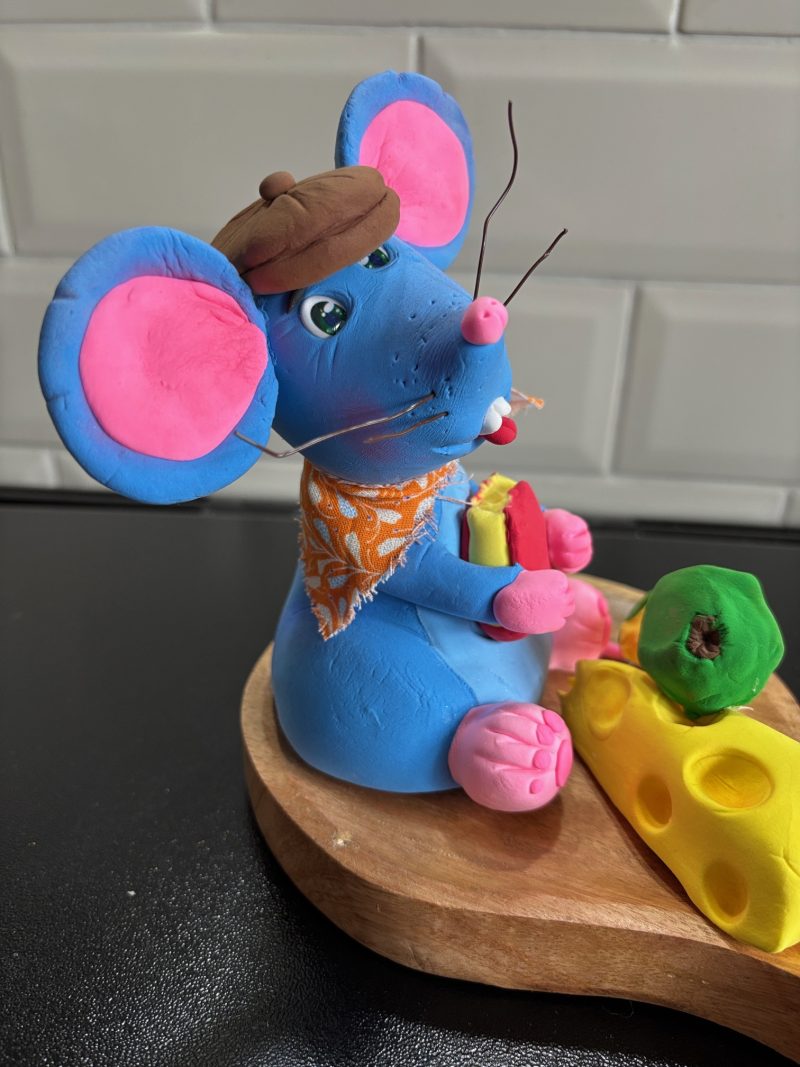 Handmade Cheeky Mouse eating Cheese and Apple made from Foam Clay on a Wooden Base