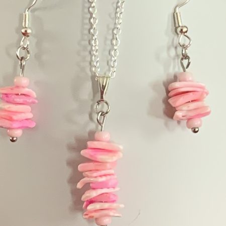 Sterling silver earrings and necklace set with pink shells inside a message in a bottle
