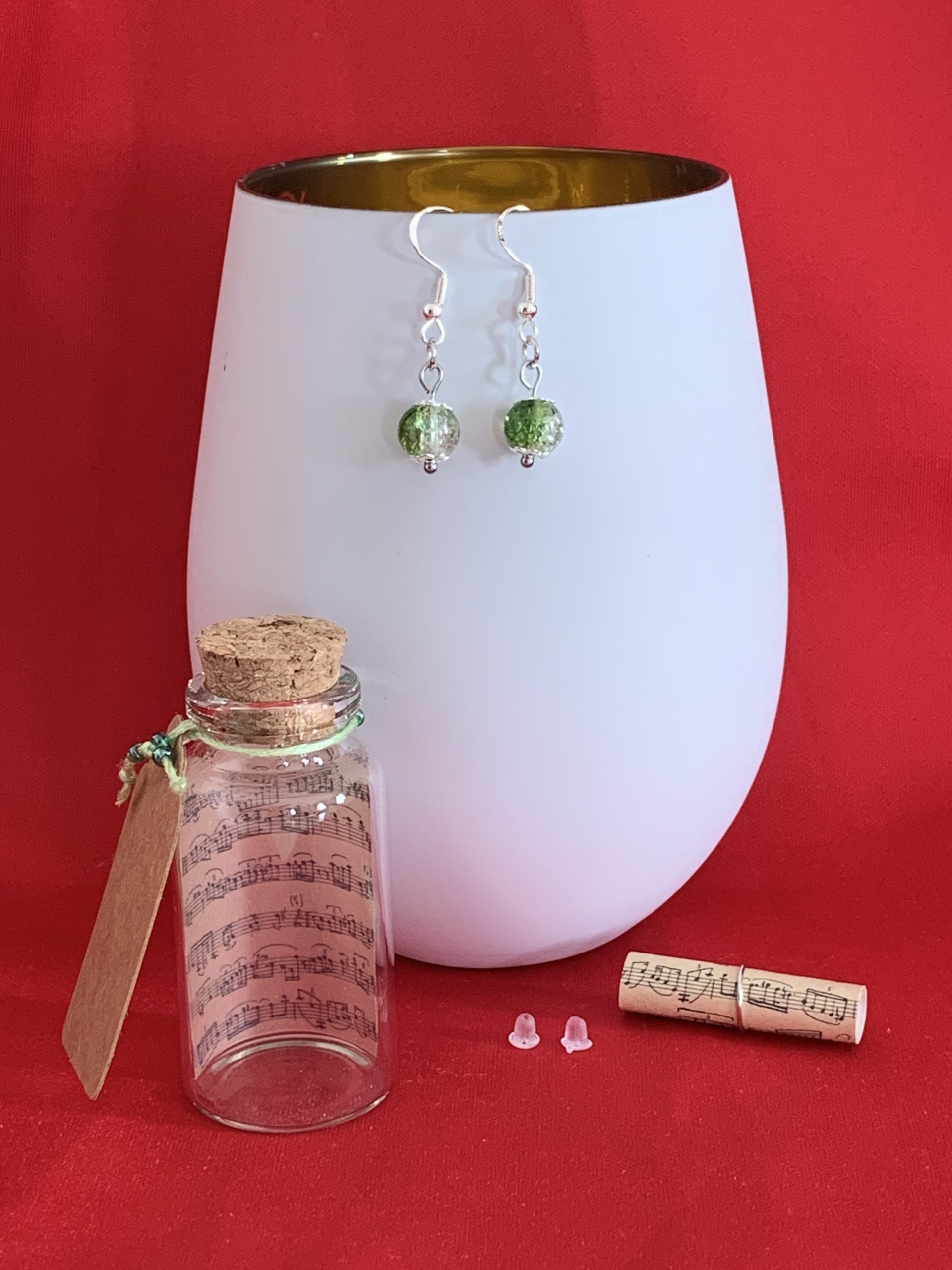Sterling silver earrings with green crackled glass beads inside a message in a bottle