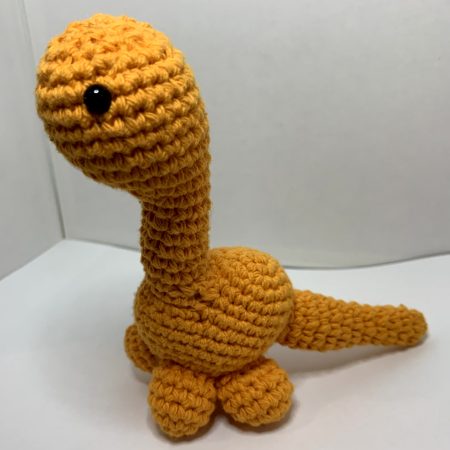 Small hand made crocheted dinosaur amigurumi keychain
