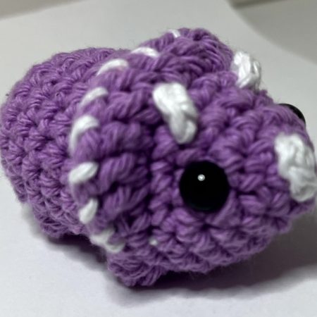 Small hand made crocheted dinosaur amigurumi keychain